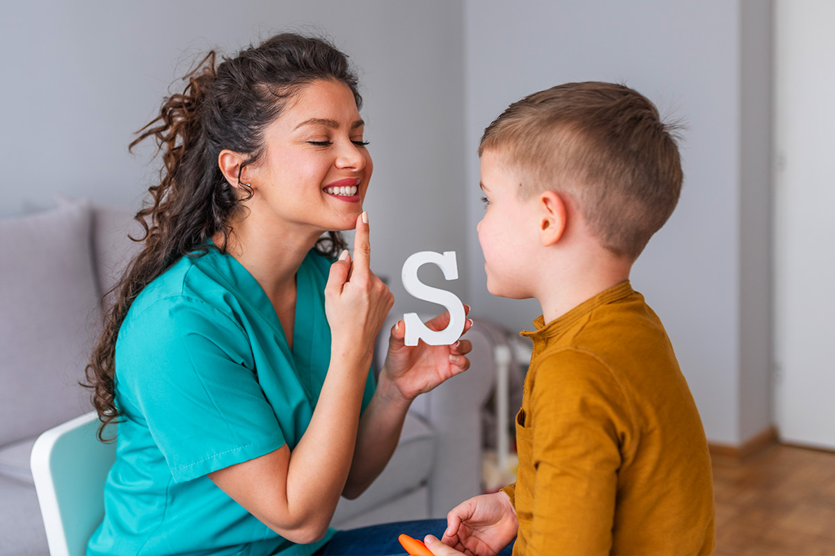 A Speech-Language Pathologist teaching an ABA Student